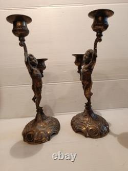 Ancienne paire de bougeoirs aux putti style Napoléon III XIXe siècle