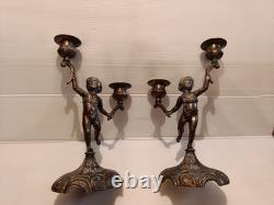 Ancienne paire de bougeoirs aux putti style Napoléon III XIXe siècle