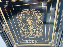 Meuble Napoléon III a une porte en bois noir et marquetrie de laiton XIX siècle