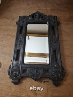Miroir Napoléon III XIXe siècle bois noirci riche décor glace biseautée