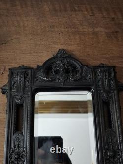 Miroir Napoléon III XIXe siècle bois noirci riche décor glace biseautée