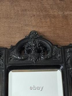 Miroir Napoléon III XIXe siècle bois noirci riche décor glace biseautée