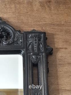 Miroir Napoléon III XIXe siècle bois noirci riche décor glace biseautée