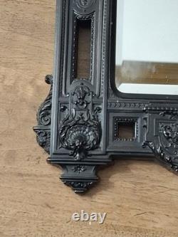 Miroir Napoléon III XIXe siècle bois noirci riche décor glace biseautée