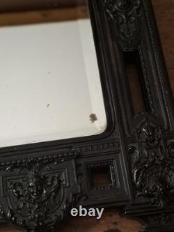 Miroir Napoléon III XIXe siècle bois noirci riche décor glace biseautée