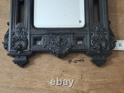 Miroir Napoléon III XIXe siècle bois noirci riche décor glace biseautée