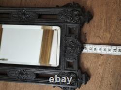 Miroir Napoléon III XIXe siècle bois noirci riche décor glace biseautée