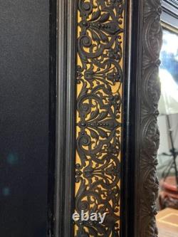 Miroir XIXe Napoléon III en bois noirci sur fond or