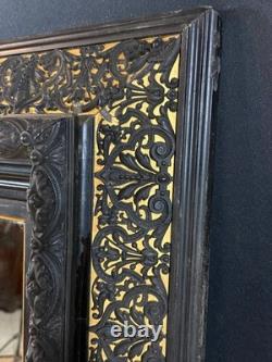 Miroir XIXe Napoléon III en bois noirci sur fond or