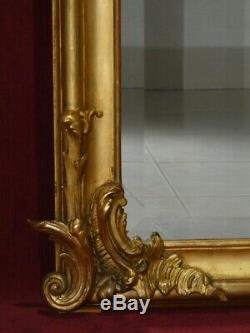 Miroir doré à la feuille d'or fronton style Louis XV époque Napoléon III XIXe