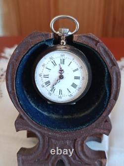 Montre en argent du XIX Napoléon III avec son porte montre en bois sculpté