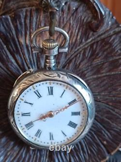Montre en argent du XIX Napoléon III avec son porte montre en bois sculpté