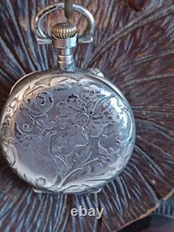 Montre en argent du XIX Napoléon III avec son porte montre en bois sculpté