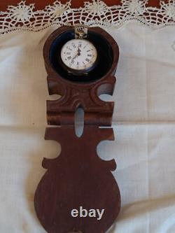 Montre en argent du XIX Napoléon III avec son porte montre en bois sculpté