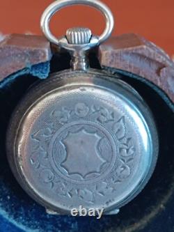 Montre en argent du XIX Napoléon III avec son porte montre en bois sculpté