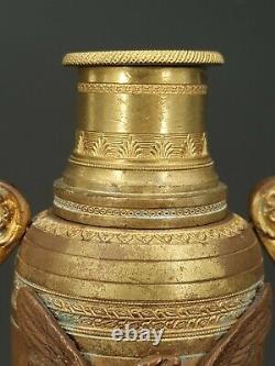 Paire de cassolettes formant bougeoirs en bronze doré XIX ème s