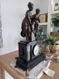 Pendule de cheminée Napoléon III en marbre noir et régule XIXe