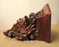 Petite console d'applique XIXe en bois finement sculpté décor d'un ange angelot