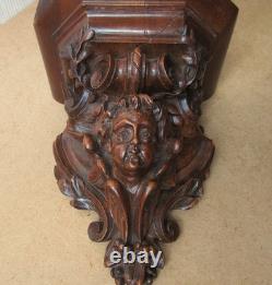 Petite console d'applique XIXe en bois finement sculpté décor d'un ange angelot