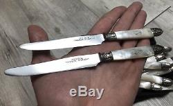 Suite de 12 anciens couteaux en nacre argent et métal argenté Modèle ruban XIXè